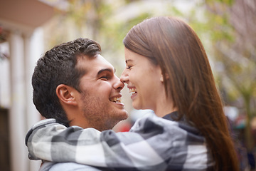 Image showing Love, hug and happy couple laughing together, having fun and enjoy outdoor date with care, support and romance. Wellness, funny joke and face of boyfriend, girlfriend or people embrace in urban city