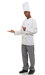 Image showing Man, chef and pointing with hands, portrait and confident guy on white studio background. African person, culinary expert or mockup space with career, food industry and employee with uniform