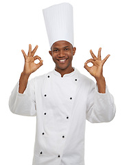 Image showing Man, chef and portrait with okay sign, culinary expert and confident guy on white studio background. African person, professional and mockup space with career, food industry and employee with uniform