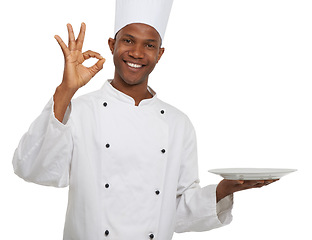 Image showing Portrait, chef and ok sign with plate presentation in studio isolated on white background. Smile, cooking or okay hand gesture of African man, show empty dish or restaurant success with perfect emoji