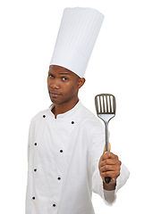 Image showing Man, chef and portrait with spatula tool in studio isolated on white background. Face, professional cook and kitchen turner, metal or utensil for serious African restaurant worker in catering service