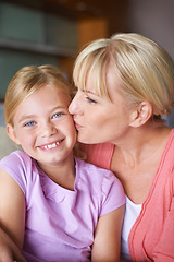 Image showing Mother, girl and kiss for love in portrait, bonding and caring in childhood by single parent at home. Daughter, mommy and together in living room, embrace and security or happiness and connection