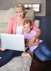 Image showing Mother, child and streaming movie on laptop, internet connection and relaxing on living room floor. Mommy, daughter and subscription to entertainment, happy and website for series and online game
