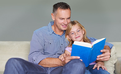 Image showing Father, child and reading book for knowledge at home, story and fantasy fiction for education. Daddy, daughter and bonding together on sofa, literacy and support for language development in childhood