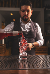 Image showing Barman making cocktail