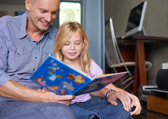 Image showing Father, child and reading book at homeschool, learning and fantasy fiction for education at home. Daddy, daughter and bonding together in childhood, literacy and storytelling for language development