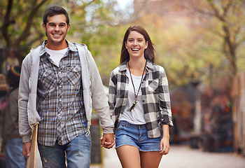 Image showing Portrait, walk and couple holding hands, smile and happy on relax journey, morning trip or weekend date. Relationship bond, lover and young romantic people commute on street, road or sidewalk