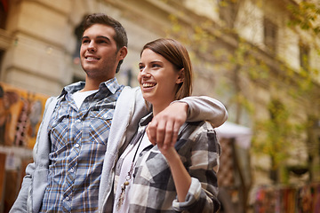 Image showing Smile, hug and couple walking on city date, morning trip and vacation tour to explore urban Argentina on outdoor adventure. Love, travel and happy people bond together, relax and connect on journey