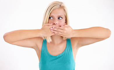 Image showing Surprise, secret or woman cover mouth and thinking about announcement in studio on white background. Wow, shocked and girl with wtf, fake news or omg expression for gossip, mistake or crazy news