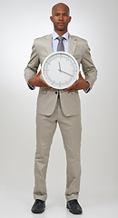 Image showing Businessman, portrait and clock for deadline as professional lawyer for schedule, hurry or punctual. Black person, face and time or white background in studio or company job efficient, hour or mockup