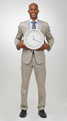 Image showing Businessman, portrait and clock time for deadline as professional lawyer for schedule, hurry or punctual. Black person, face and white background in studio for company job efficient, hour or mockup