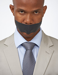 Image showing Businessman, portrait and tape on mouth secret or corporate censored for silence, blackmail or quiet. Black person, face and journalist in company trouble or white background, studio or restriction