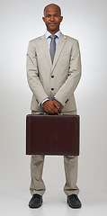 Image showing Black businessman, portrait and briefcase in studio in confidence, happy and finance career in pride. African man, smile face and positive as accountant and corporate professional by white background