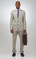 Image showing Black businessman, portrait and positive by briefcase in studio, confident and law career in pride. African man, face and formal fashion for attorney and corporate professional by white background