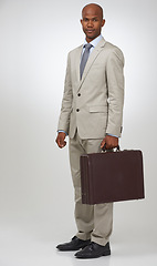 Image showing Black businessman, portrait and smile by briefcase in studio, confident and law career as attorney. African man, face and positive in formal fashion for lawyer and professional by white background