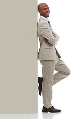 Image showing Happy businessman, portrait and leaning on wall with arm crossed in confidence on a white studio background. Young black man or professional employee smile in business fashion or suit on mockup space