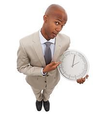 Image showing Businessman, portrait and face clock for corporate professional lawyer for deadline, hurry or time management. Black person, point and white background in studio for company efficient, hour or mockup