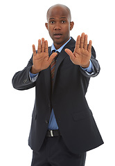 Image showing Businessman, portrait or hand gesture in studio for stop for danger warning or threat on white background. African worker, palm or body language with attention, worry or fear for protection or safety