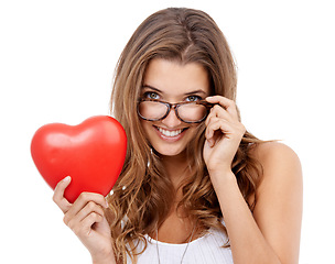 Image showing Woman, portrait and heart for romance in studio, smiling and confidence with emoji on white background. Female person, happy and icon or sign for love on valentines day, support and peace or kindness