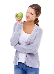 Image showing Woman, portrait and apple for fiber in studio, organic snack and fruit for wellness. Female person, vitamins and minerals for healthy living, nutrition and vegan food on white background for detox