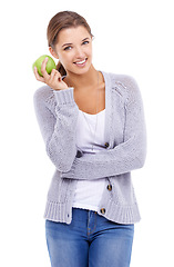 Image showing Woman, portrait and apple for detox in studio, organic fiber and fruit for wellness. Female person, vitamins and minerals for healthy living, snack and vegan food on white background for nutrition