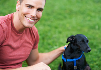 Image showing Man, dog and portrait on outdoor field for bonding connection, pet training for obedience. Male person, animal and face at rescue shelter garden for happy home care, environment walk on grass hug