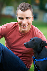 Image showing Man, dog and portrait at outdoor park for bonding connection, pet training for obedience. Male person, animal and face at rescue shelter garden for happy home care, environment walk on grass field