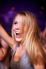 Image showing Woman, dancing and music festival, happy and party in nightclub, celebrating and dj event. Disco, rock and freedom with girl dancer in crowd of fans for celebration, energy and techno performance