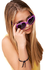 Image showing Sunglasses, cool fashion or portrait of girl teenager in studio isolated on white background with blonde hair. Pride, casual child or confident model with swag, style or trendy heart shaped eyewear