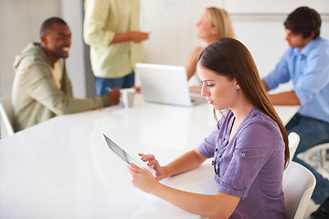 Image showing Tablet, research and business woman at desk, networking and internet app in startup office. Digital technology, creative designer at table and professional reading email, information and coworking