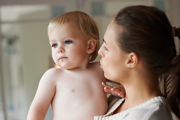 Image showing Mother, carrying baby and house with parent, family home and parenting in trust, love and support. Toddler, motherhood and infant child with face, boy and bonding together for kids childhood memories