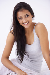 Image showing Woman, portrait and wake up to relax in bed, happy and comfortable or peace at home. Indian female person, face and smiling for dream or resting in bedroom on weekend, cozy and apartment in New Delhi