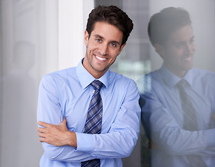 Image showing Window, crossed arms and portrait of businessman in workplace with confidence, pride and ambition. Corporate entrepreneur, professional and happy worker for career, job and working in modern office