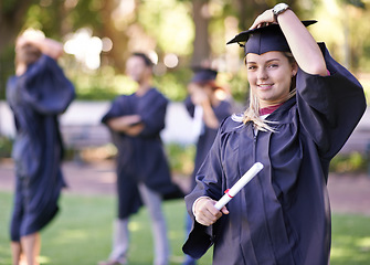 Image showing Happy woman, portrait and student with degree in graduation for education, learning or qualification. Female person or graduate smile for higher certificate, diploma or award at outdoor ceremony