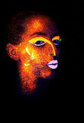 Image showing Portrait, beauty and creative with neon woman on black background for makeup, glitter or colorful glow. Face, fantasy and art with confident young person in the dark for psychedelic or techno paint