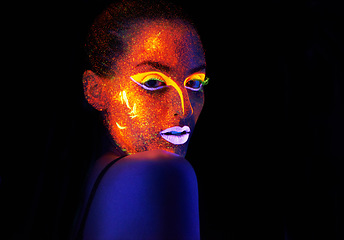 Image showing Portrait, art and creative with neon woman on black background for makeup, glitter or colorful glow. Face, fantasy and beauty with confident young person in the dark for psychedelic or techno paint