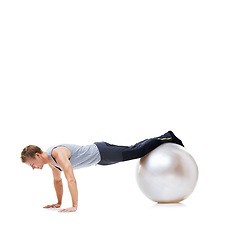 Image showing Man, fitness and exercise ball for workout, balance or health and wellness against a white studio background. Active male person or athlete on round object for training or pilates on mockup space