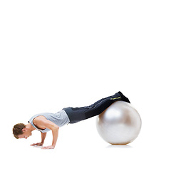 Image showing Man, push ups and exercise ball for fitness, workout or health and wellness against a white studio background. Active male person or athlete on round object for training or pilates on mockup space