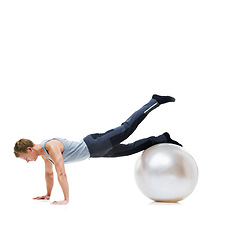 Image showing Yoga ball, fitness and man in a studio with a body, health and wellness exercise for balance. Sports, equipment and young male athlete with stretching workout or training isolated by white background