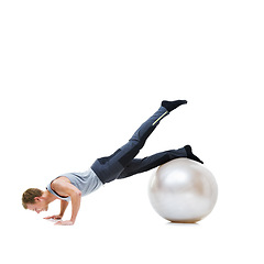 Image showing Man, push ups and balance on exercise ball for fitness, workout or health and wellness on a white studio background. Active male person or athlete on round object, training or pilates on mockup space