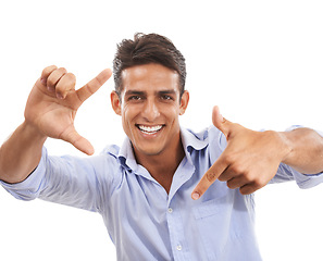 Image showing Portrait, man and smile with finger frame in studio to review profile picture, selfie or creativity on white background. Happy model planning perspective for photography, creative border or hand sign