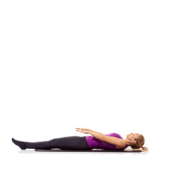 Image showing Yoga mat, health and wellness with woman in studio for peace, exercise and relax. Workout, fitness and self care with female person on floor of white background for pilates, body or mockup space