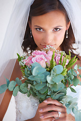 Image showing Woman, portrait and flower bouquet in wedding dress for marriage commitment, love promise or diamond ring. Female person, face and plant or veil for pride romance, partnership or celebration event