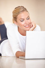 Image showing Home, thinking and woman on the floor, laptop and communication with internet, social media and typing. Person, apartment and girl with technology, connection and digital with network and relax