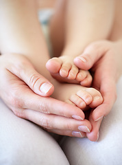 Image showing Love, person and hands with newborn or feet for development, nurture and bonding in nursery of apartment. Family, parent and baby toes with trust, support or care for relationship or closeup in home