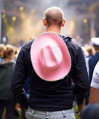 Image showing Man, crowd and music festival event audience or cowboy hat, rave outfit at party concert. Male person, back view and dj dancing night a social vacation for holiday relax experience, band to celebrate