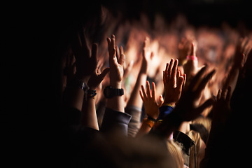 Image showing Hands, crowd or audience or music festival at night for a party or event of celebration together. Concert, disco or dance with a group of people outdoor at a carnival for performance or entertainment