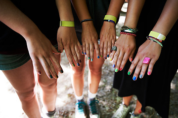 Image showing Hands, manicure and woman friends at music festival together, in a circle outdoor closeup from above. Party, concert or show with a group of people at a carnival for performance or entertainment