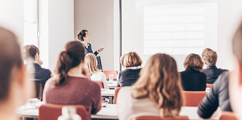 Image showing Woman giving presentation in lecture hall at university.