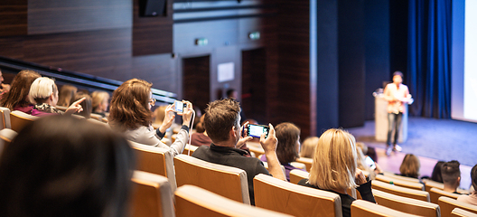 Image showing Conference and Presentation. Audience at the conference hall. Business and Entrepreneurship. Faculty lecture and workshop. Audience in the lecture hall. Academic education. Student making notes